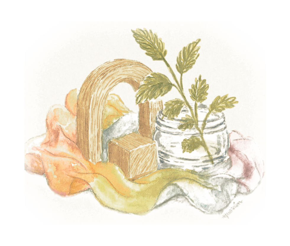 A small wooden archway and cube beside a glass jar of fresh herb cuttings, draped with soft rainbow silks — natural toys and materials from the Infant Atelier home nursery.